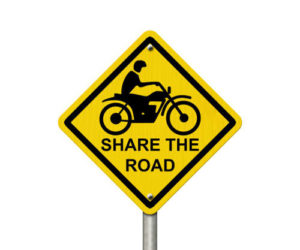 share the road warning sign